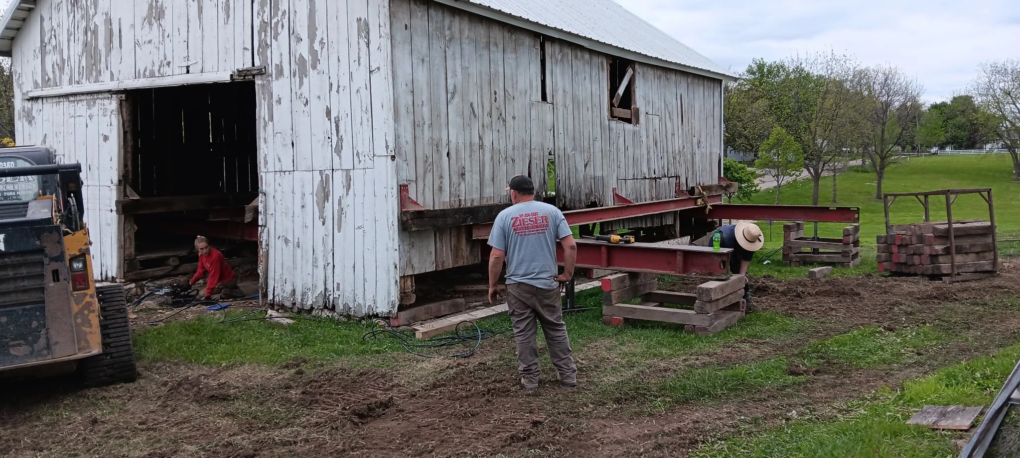 5/5/2026 Meyers Farmstead Historic District corn crib/hog barn starting restoration with lifting the barn to allow for restoration work on the foundation.