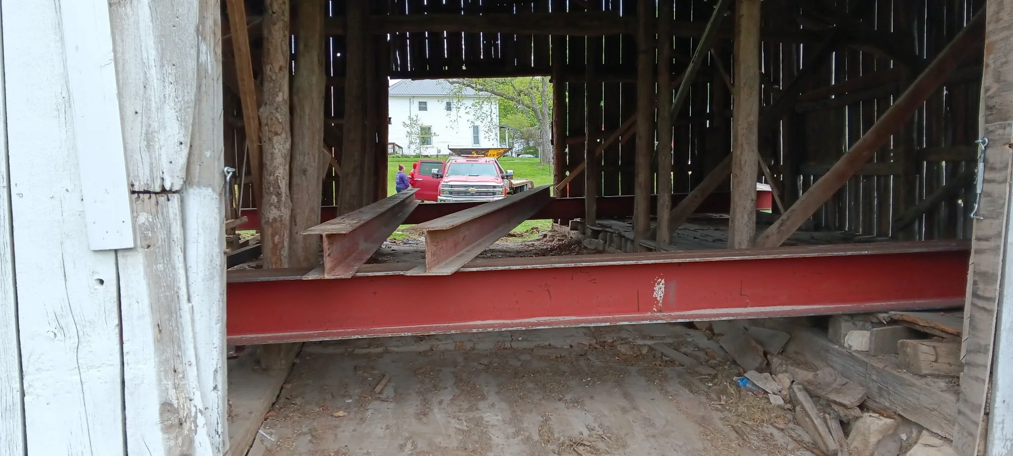 5/5/2026 Meyers Farmstead Historic District corn crib/hog barn starting restoration with lifting the barn to allow for restoration work on the foundation.