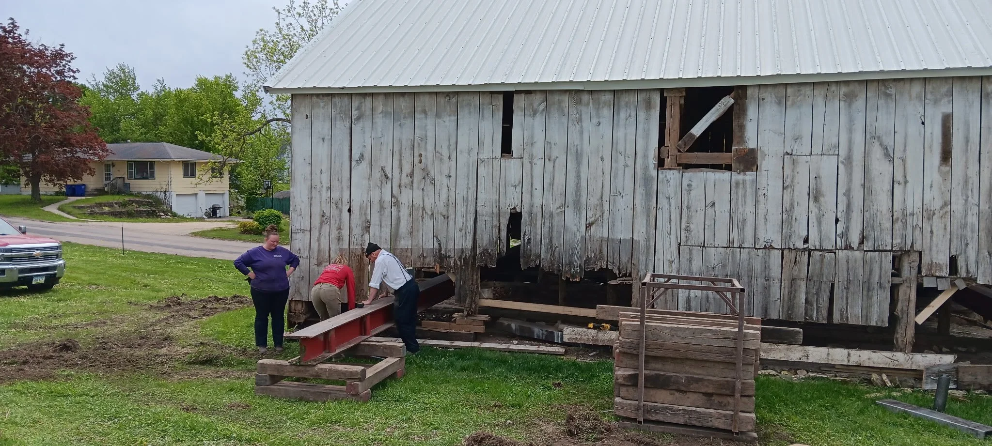 5/5/2026 Meyers Farmstead Historic District corn crib/hog barn starting restoration with lifting the barn to allow for restoration work on the foundation.