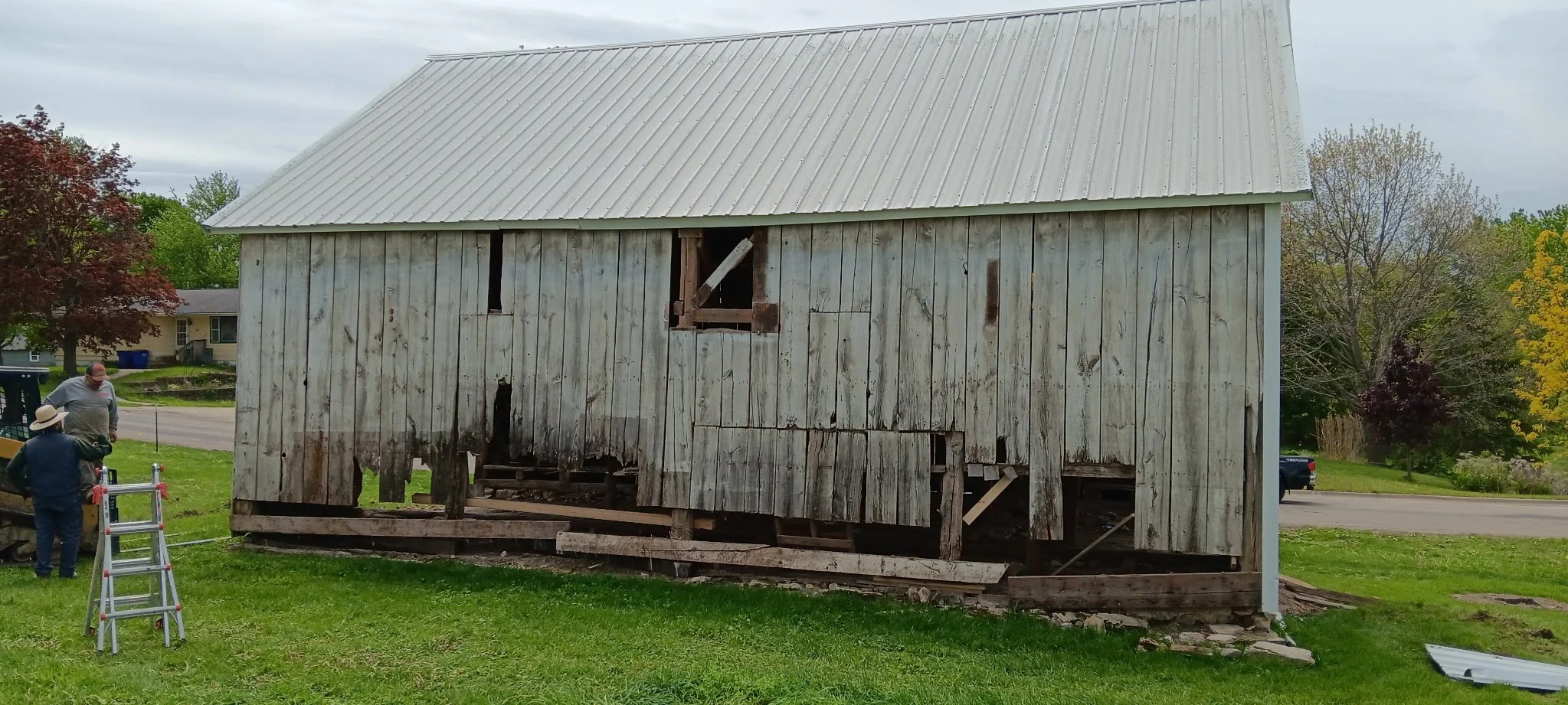 5/5/2026 Meyers Farmstead Historic District corn crib/hog barn starting restoration with lifting the barn to allow for restoration work on the foundation.