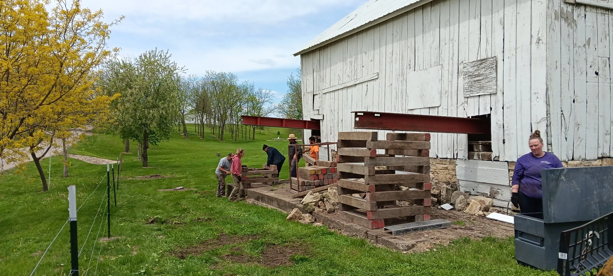 5/5/2026 Meyers Farmstead Historic District corn crib/hog barn starting restoration with lifting the barn to allow for restoration work on the foundation.