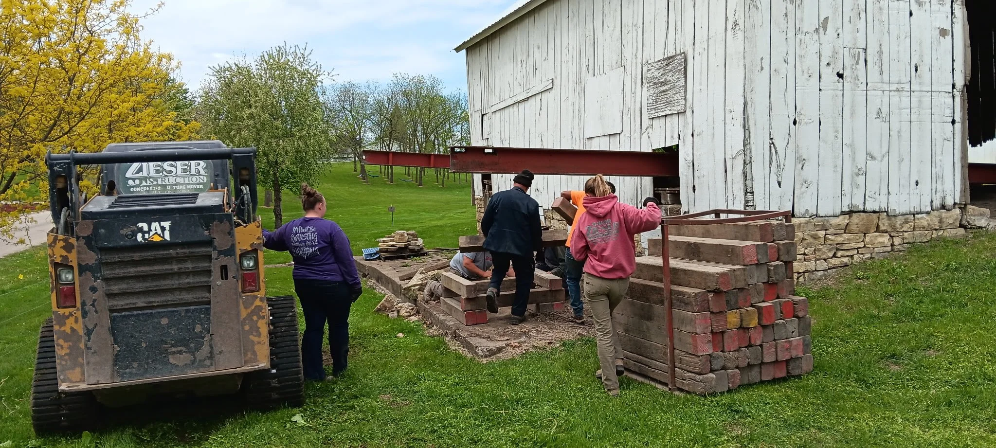 5/5/2026 Meyers Farmstead Historic District corn crib/hog barn starting restoration with lifting the barn to allow for restoration work on the foundation.