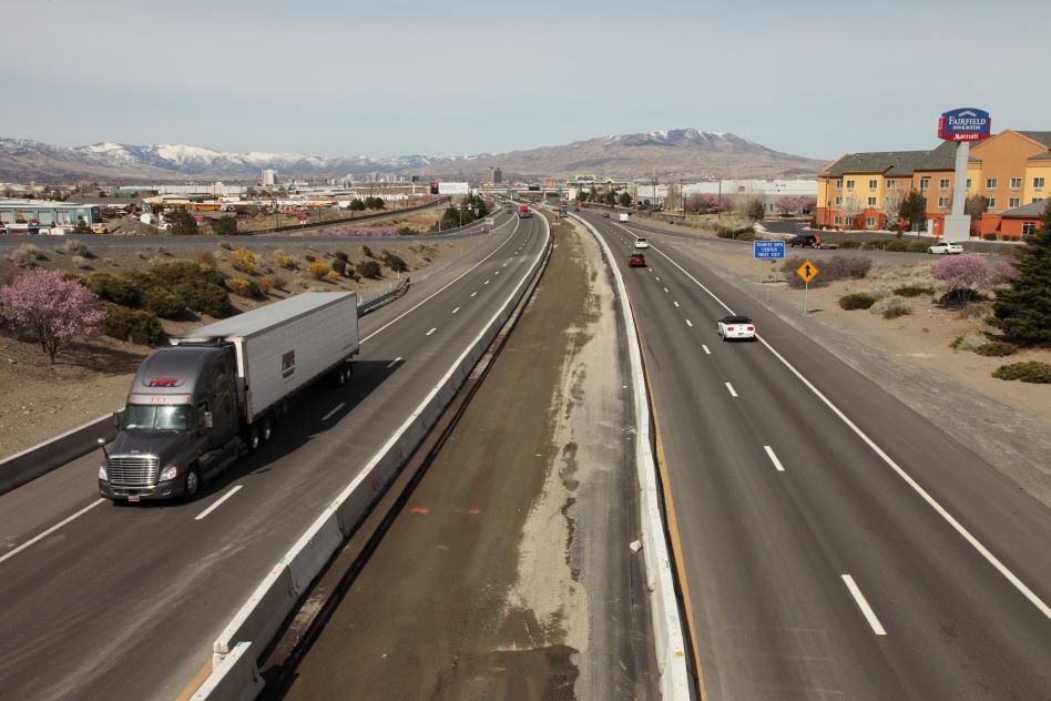 A semi truck and other vehicles traveling down I-80 in Nevada