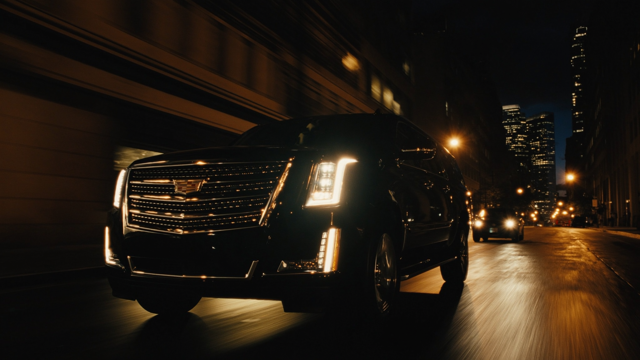 Black SUV driving in boston at night