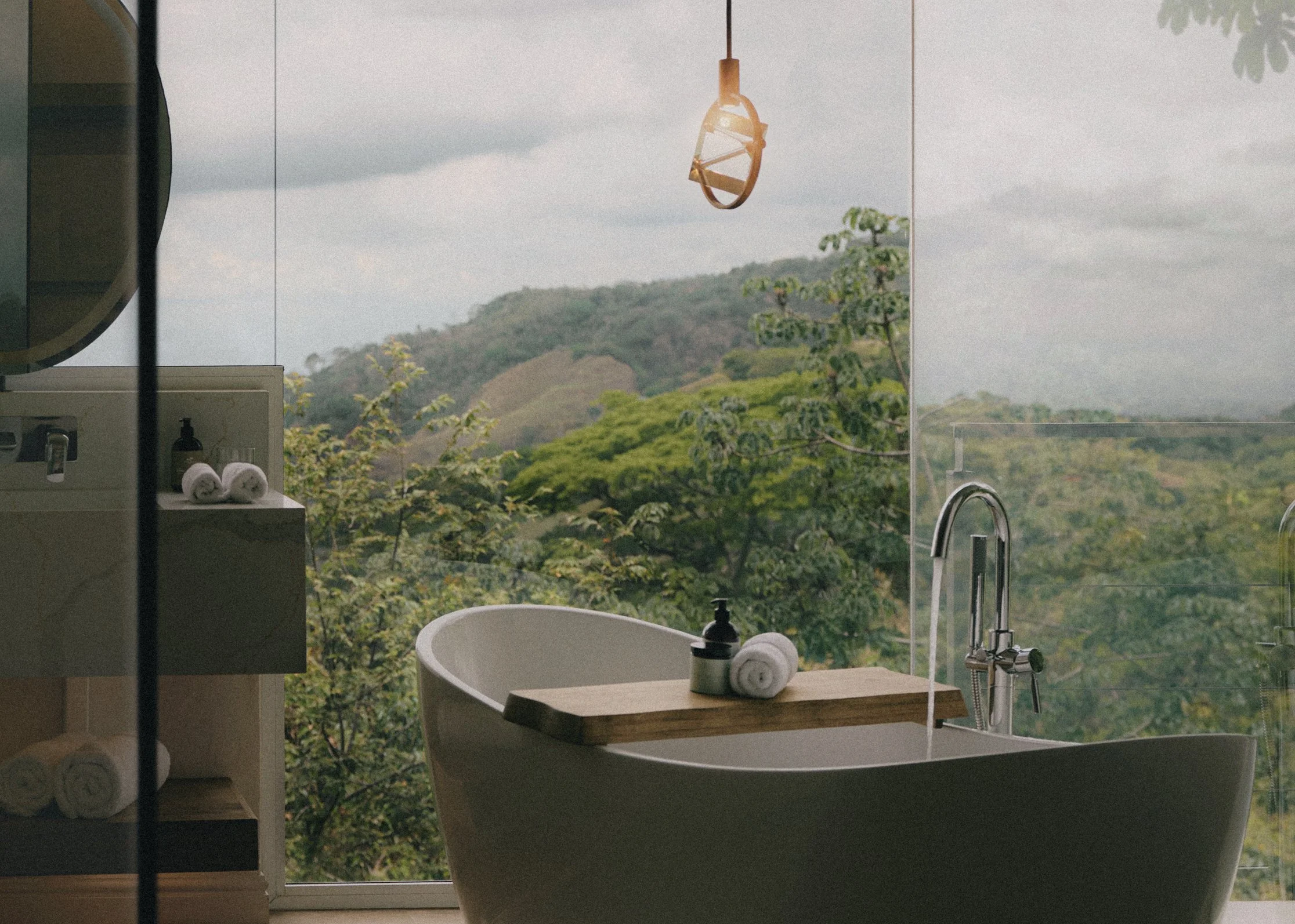 The Retreat Costa Rica: freestanding bathtub facing the mountains through floor-to-ceiling glass