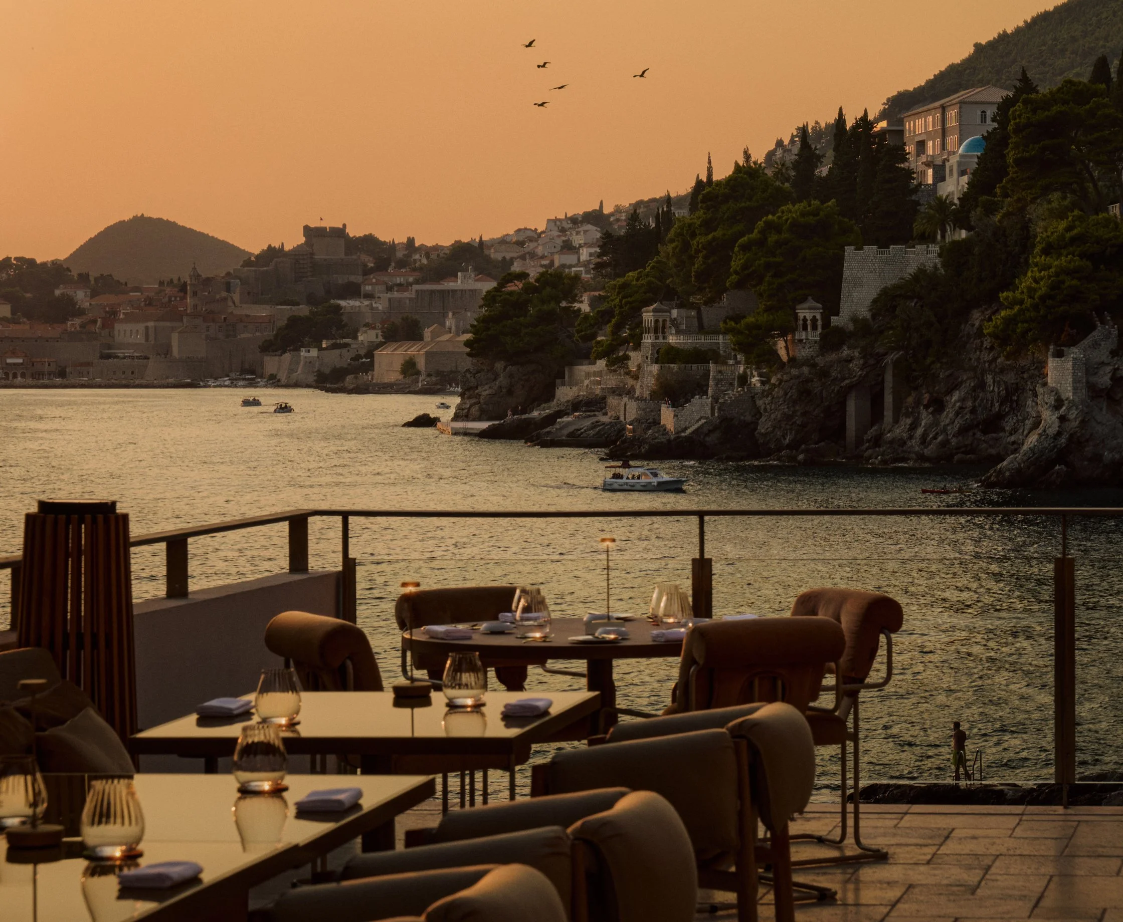 Villa Dubrovnik, Croatia: restaurant terrace overlooking the coast at sunset