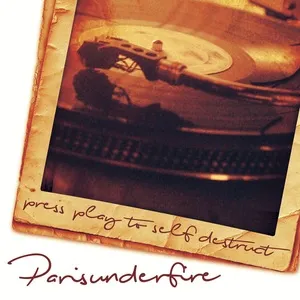 A close-up of a vinyl record on a turntable with a handwritten note that reads 'press play to self destruct' and the words 'Paris under fire' at the bottom. Album art.