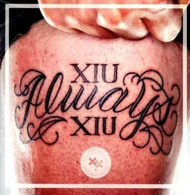 Album art depicting a close-up of a tattoo on skin of a man for the band "XIU XIU" and a title: "Always".