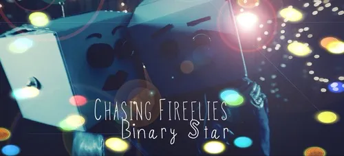 A person wearing a costume with a star-shaped face mask, holding a wand, at night with colorful light orbs, with the text 'Chasing Fireflies Binary Star' overlayed. Album artwork.