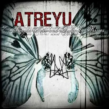 Album cover with butterfly wings, the word 'Atreyu' in red, and a stylized dark signature or logo in the center. Album art for a "Suicide Notes and Butterfly Kisses".
