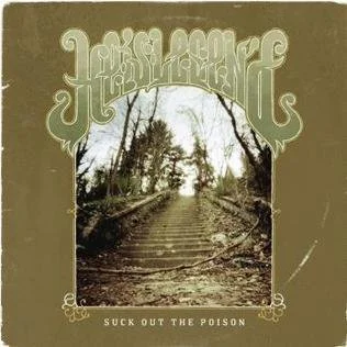 A sepia-toned cover with a central image of a dirt path through trees, titled 'Suck Out the Poison.' He is Legend album art.