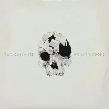 A black and white drawing of a skull on a plain background with the words 'Two Gallants' and 'We Are Undone' written next to it.