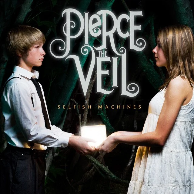 A young boy in a white shirt and tie and a young girl in a white dress hold hands, exchanging a glowing rectangular object between them, against a dark background and the title "Pierce the Veil" and the subtitle "Selfish Machines". Album art.