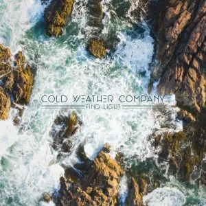 Aerial view of rocky shoreline with crashing waves and the text 'COLD WEATHER COMPANY FIND LIGHT' overlaid. Album art.