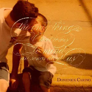 Two kids sitting on the ground, facing each other, with books in their laps, outside on a sidewalk. ALbum art for "The Only Thing that comes to Mind are Songs about Us" by Domenick Carino.