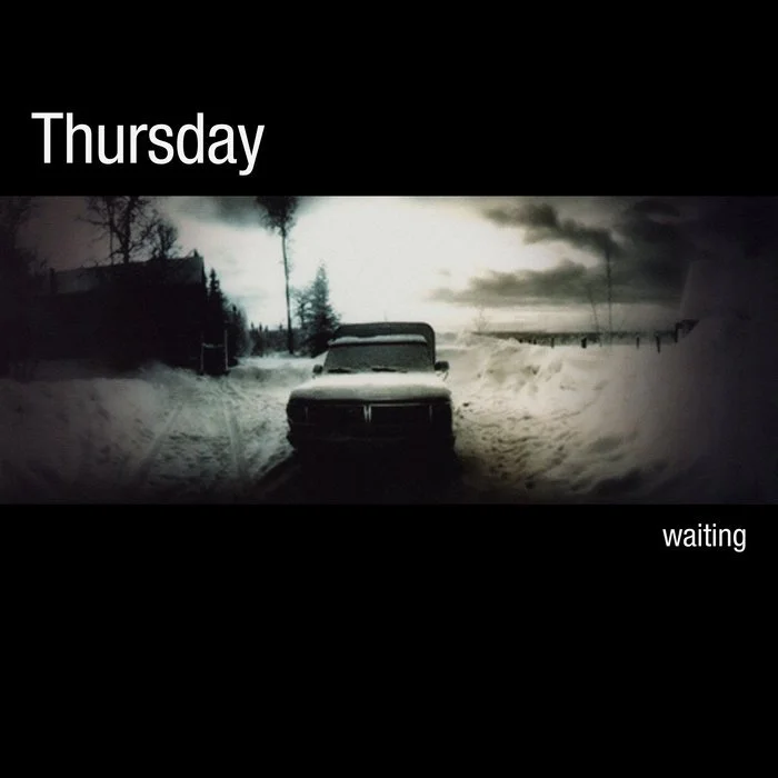 A black and white photo of a snow-covered landscape with a car in the center, trees, and a cloudy sky. The top text says 'Thursday', and the bottom right says 'waiting'. Thursday album art.
