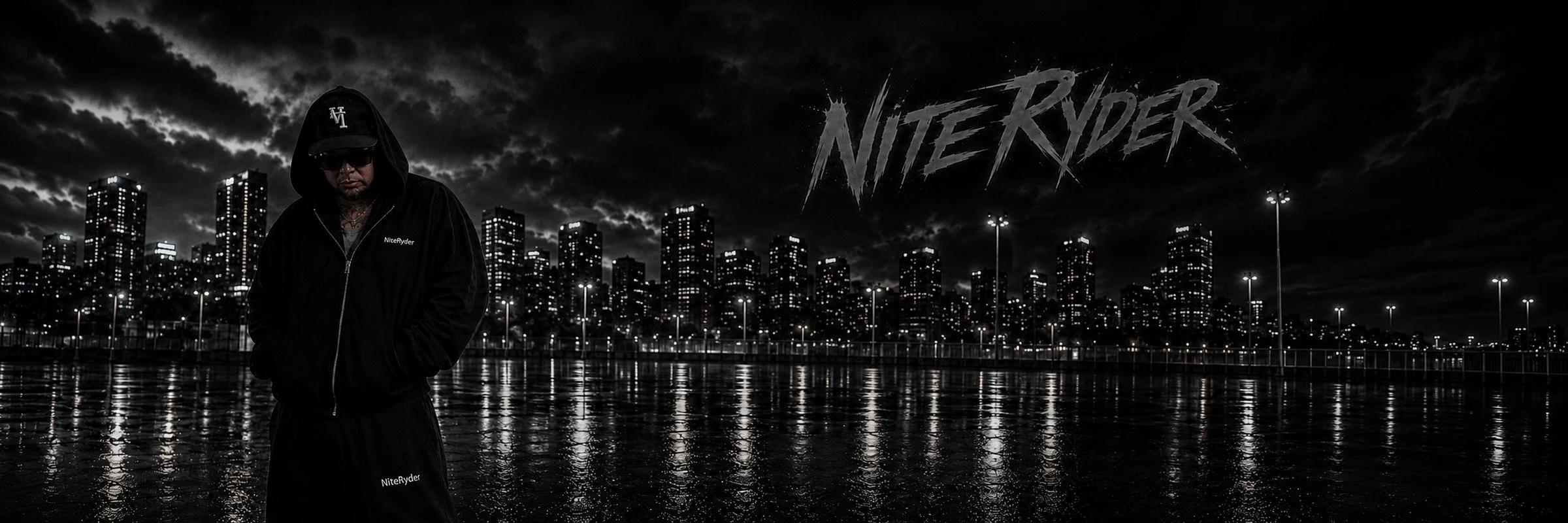 A man in dark clothing and sunglasses standing in front of a city skyline at night, with the words "Nite Ryder" visible in the sky or sky-themed background.