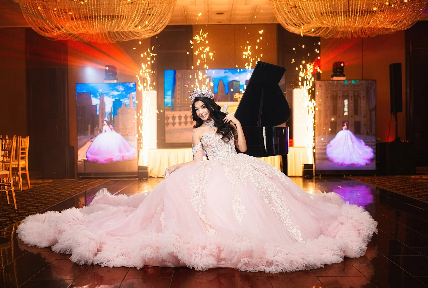 Quinceañera in a pink gown beside a grand piano with sparkling lights at her celebration