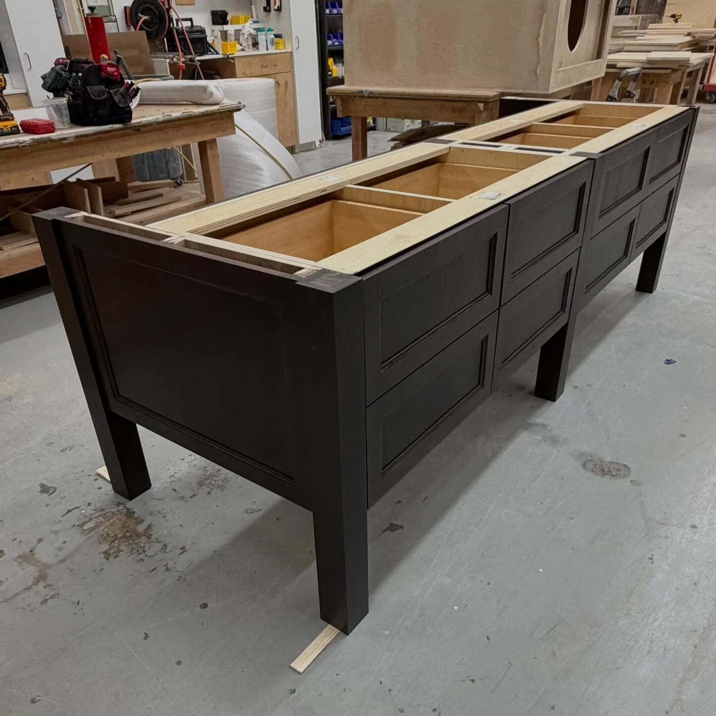Finished up this killer custom kitchen this week 🛠️ Beautiful white perimeter with accents of walnut coming from the hood and island. Really excited to see this one installed! 

#customcabinets #customcabinetry #custom #woodworking #customwoodworkin