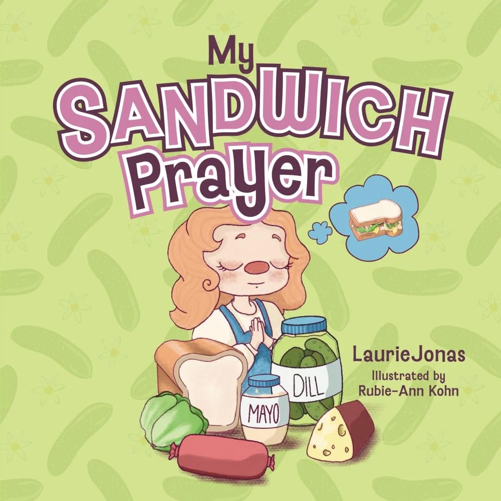 A children's book cover titled 'My Sandwich Prayer' by Laurie Jonas, illustrated by Rubie-Ann Kohn. The cover shows a girl with free-flowing hair, hands in prayer position, with a thought bubble of a sandwich. There are various food items in front of her including bread, mayonnaise, dill pickle, broccoli, sausage, and cheese. The background has a light green pattern with sandwich-related motifs.