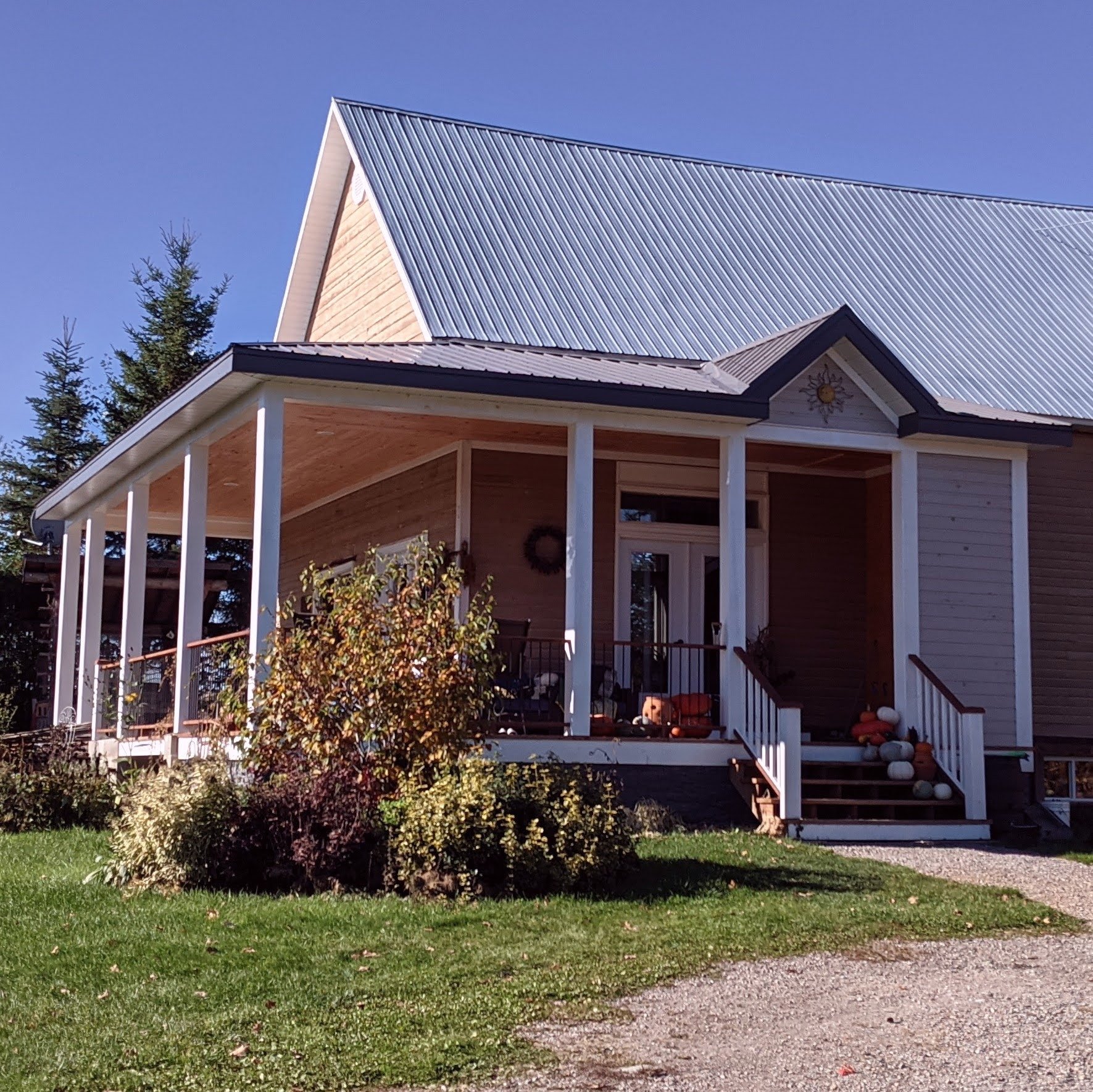 Entry and wrap around porch on old school house