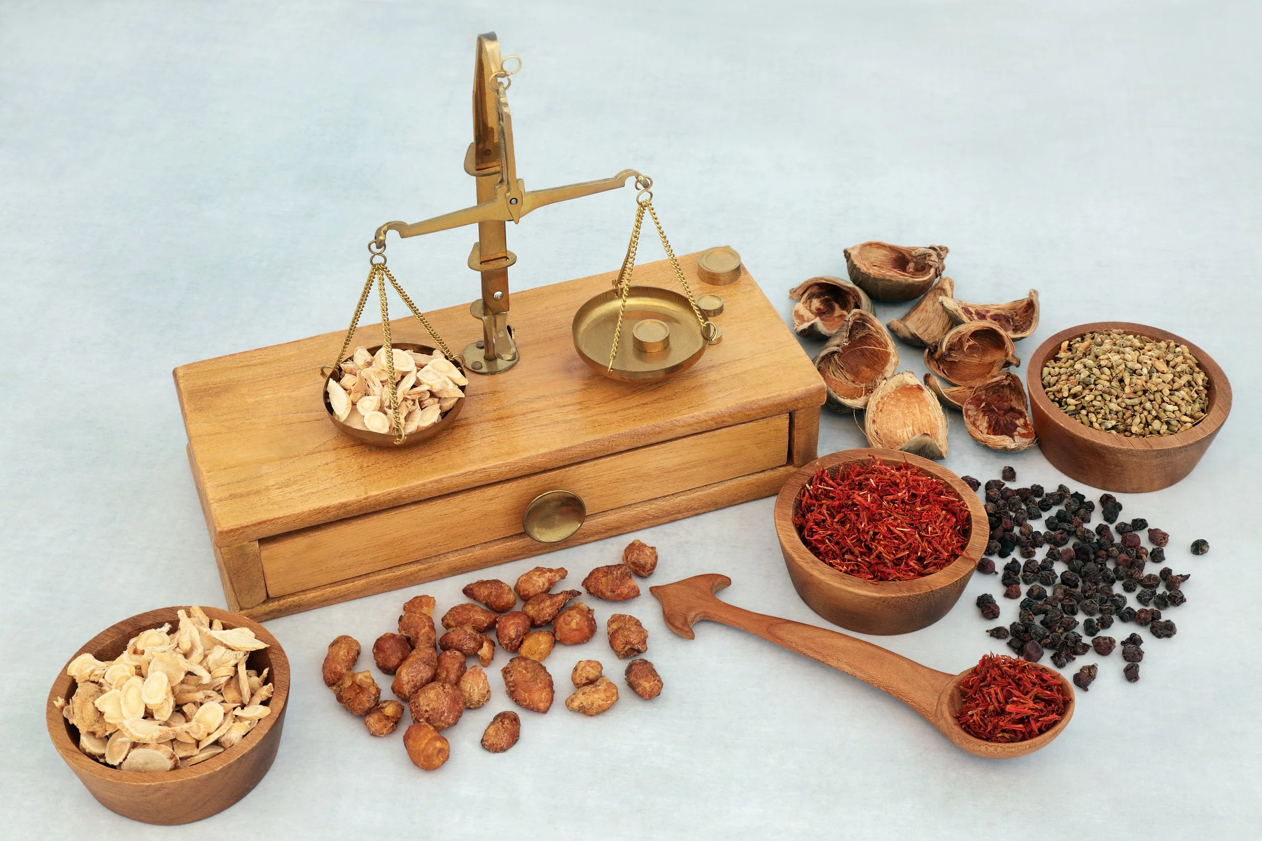 Traditional herb scale with dried herbs and seeds