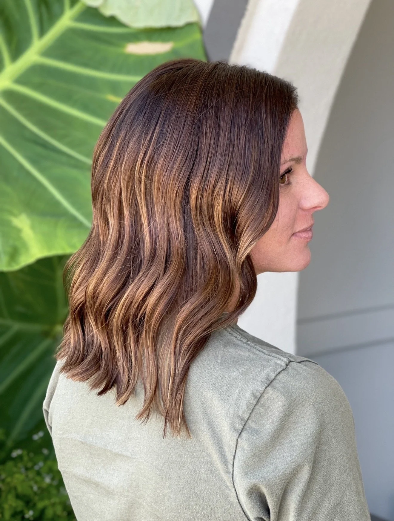 Soft lived-in dimensional brunette balayage with soft, natural-looking highlights.