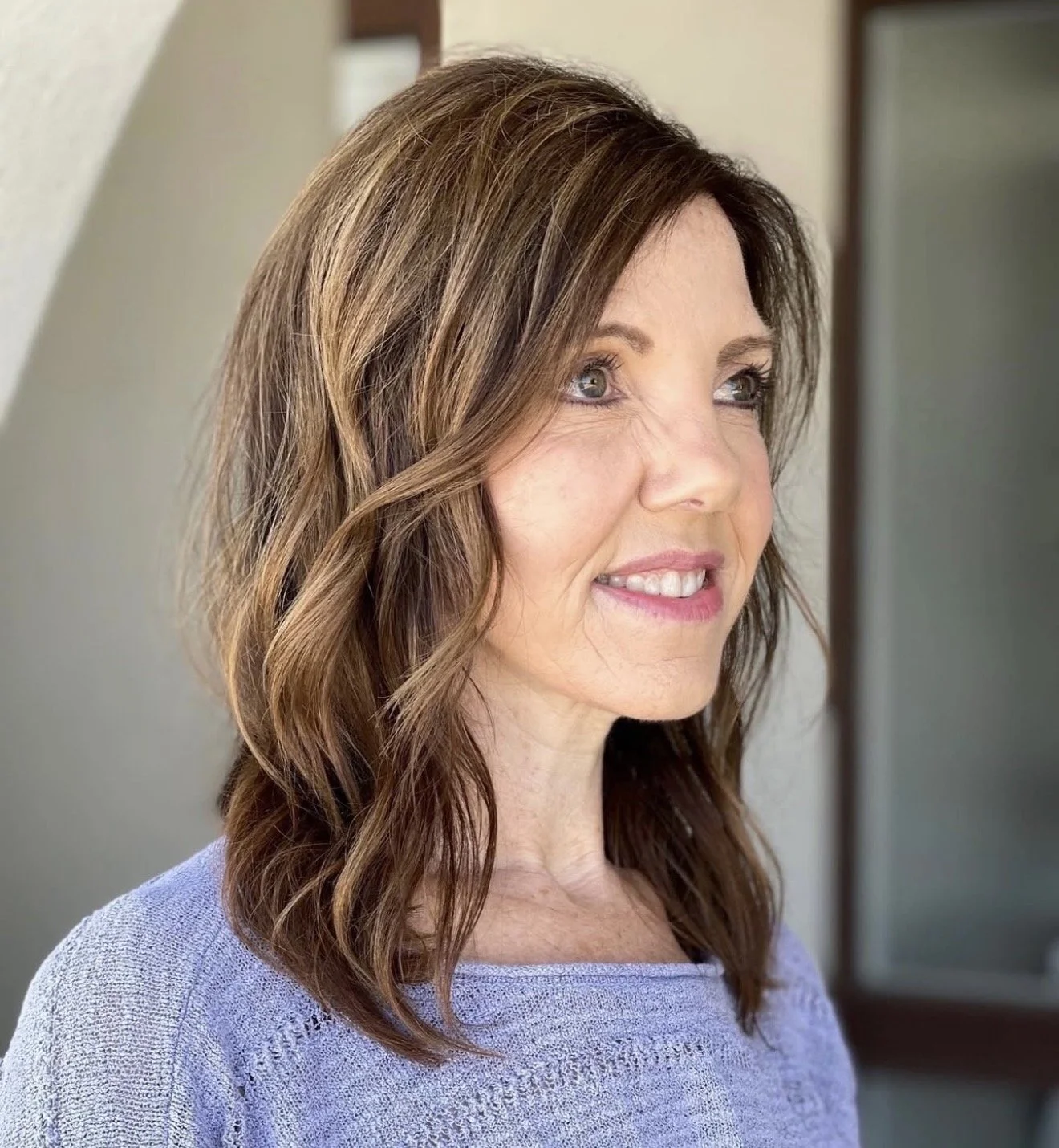 Shoulder-length precision haircut with natural movement and soft dimensional brunette color.