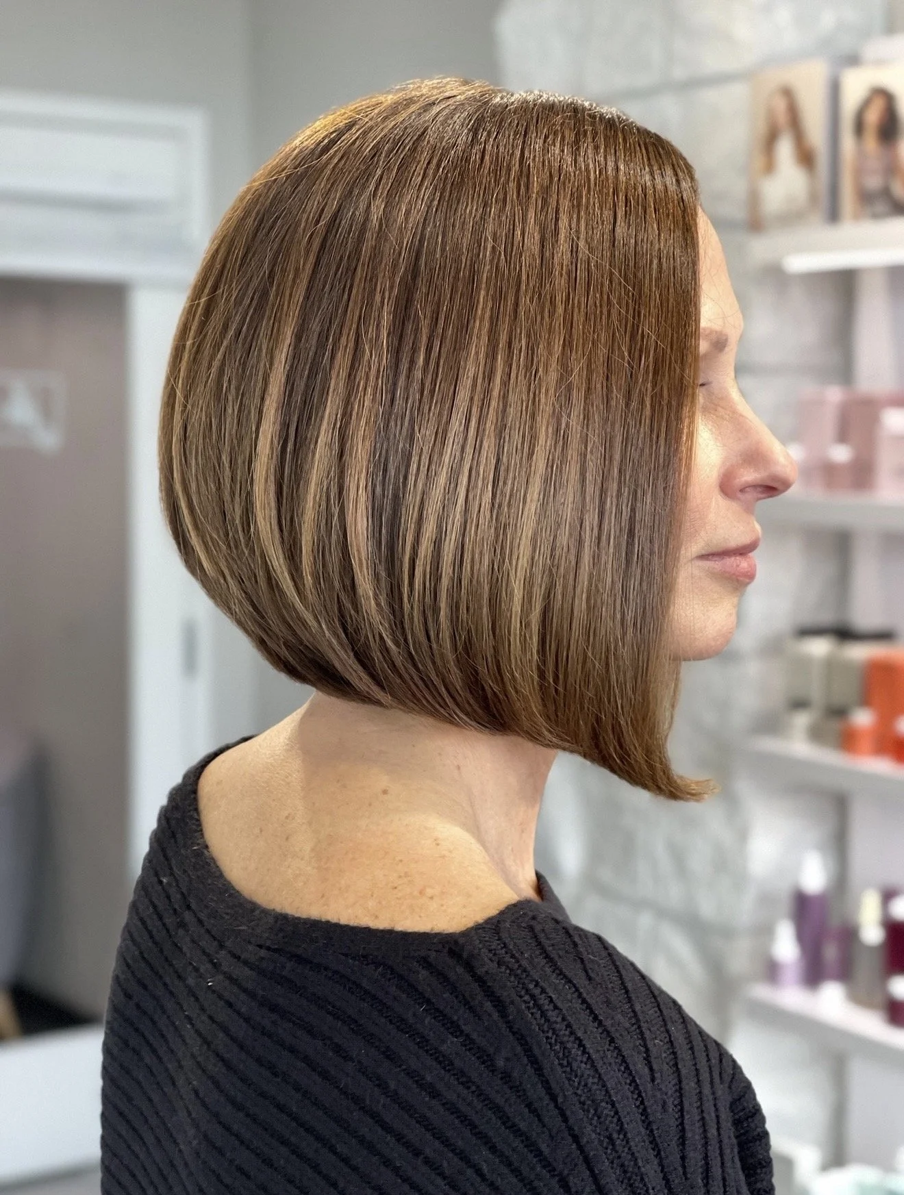 Precision bob haircut with soft dimensional brunette color by Janet Biggers. 
