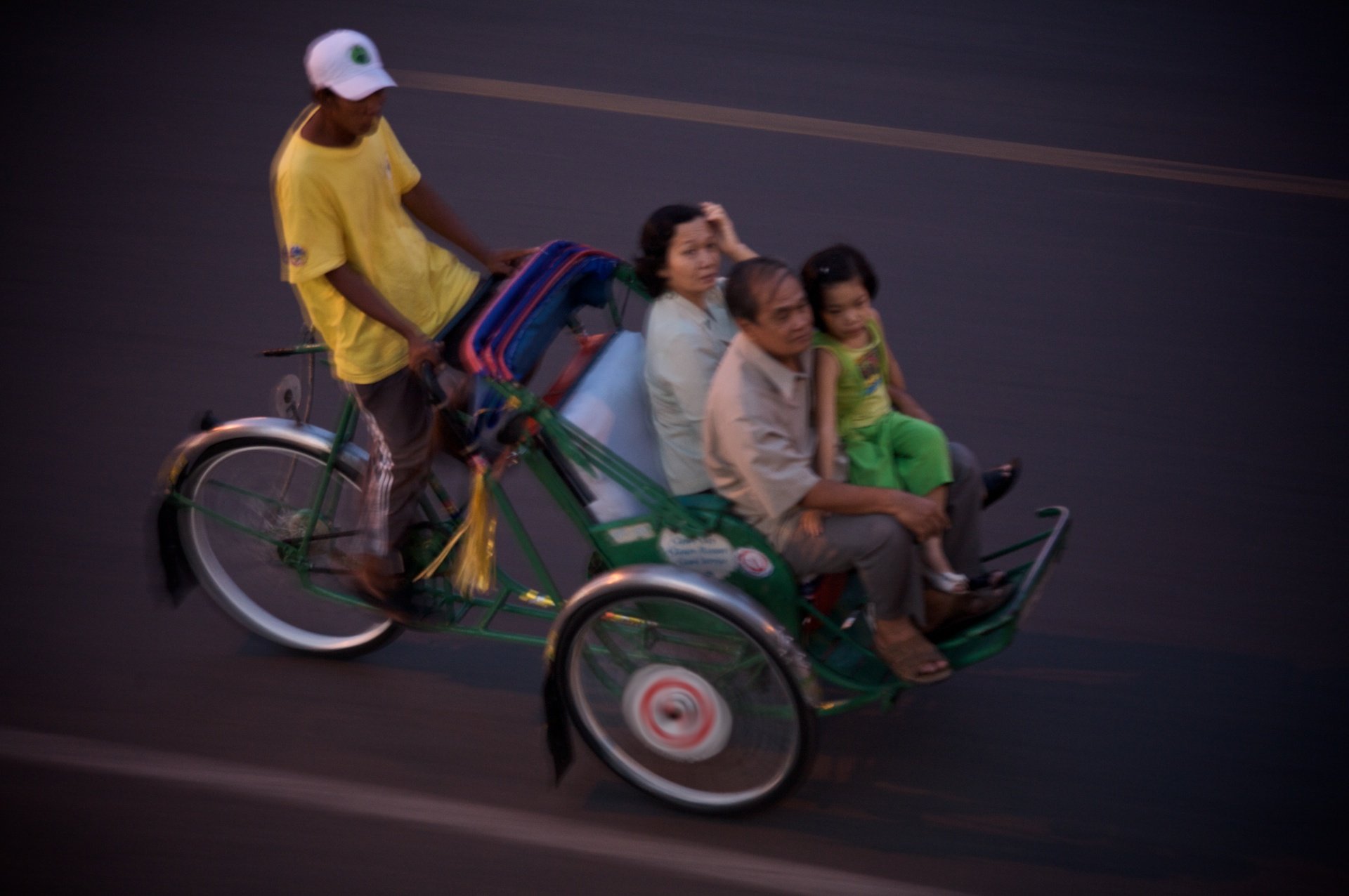 Family on bicycle rickshaw, Phnom Penh, Cambodia
