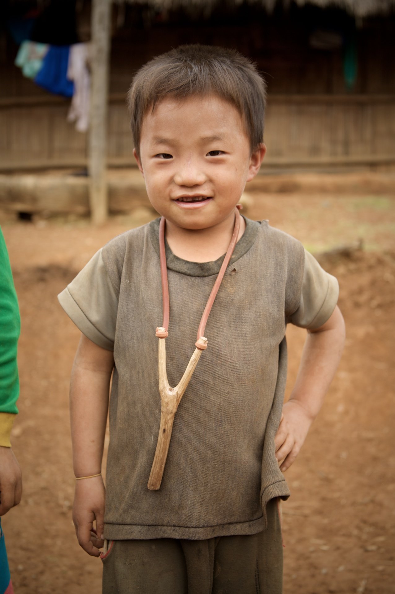 Boy with catapult, Rte 13, Laos