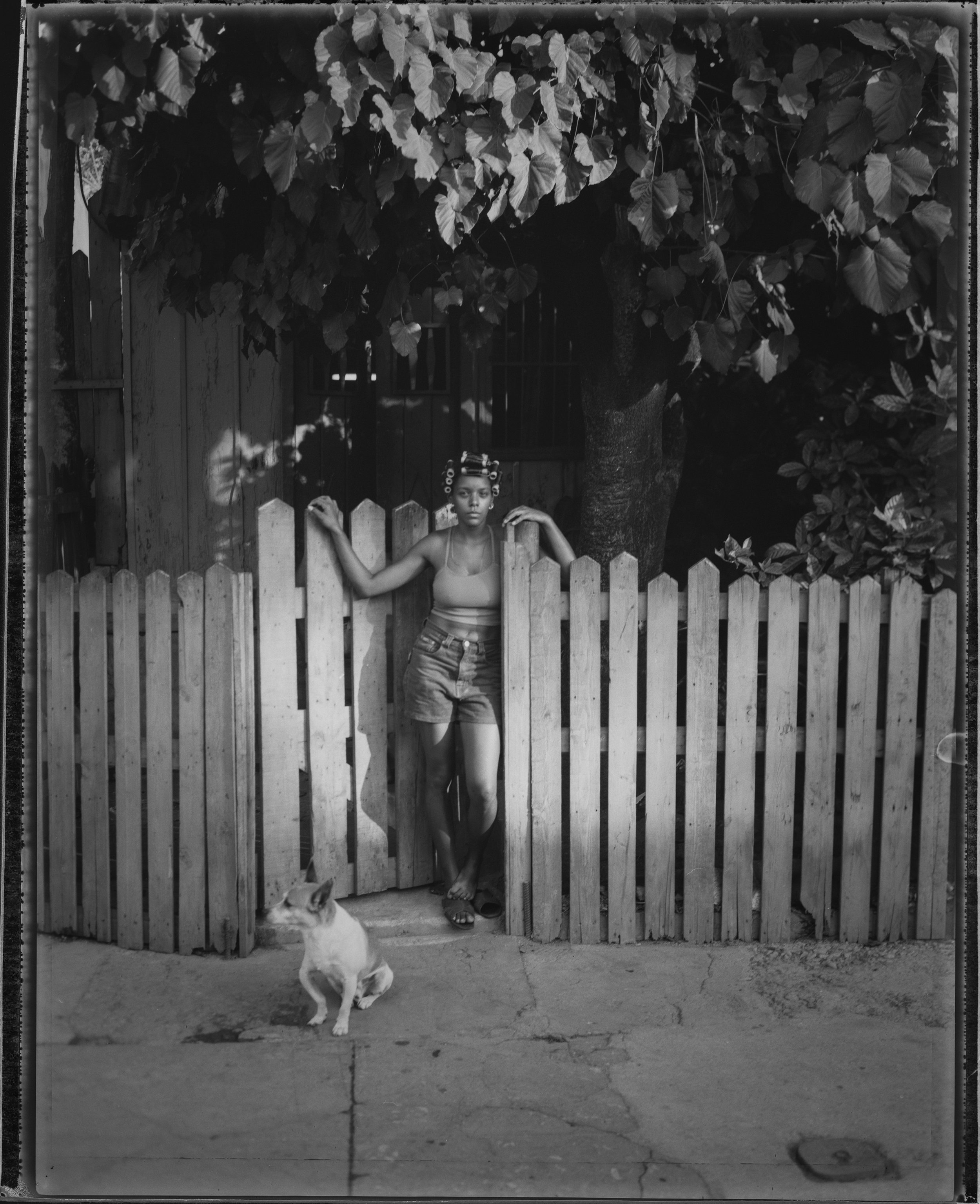 Woman with bow-legged dog, Havana Cuba