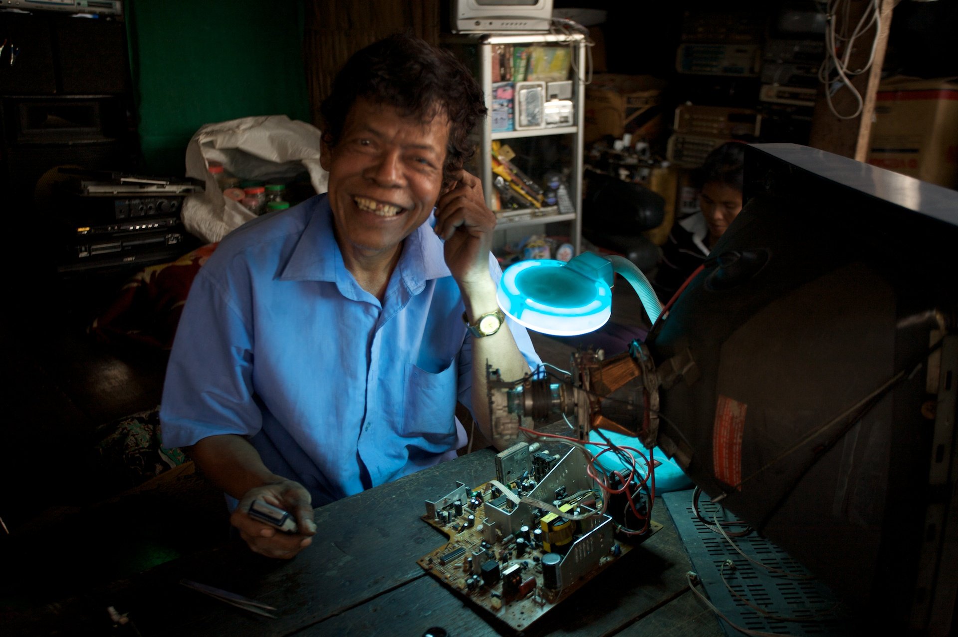Electronics repairman near Siem Reap, Cambodia