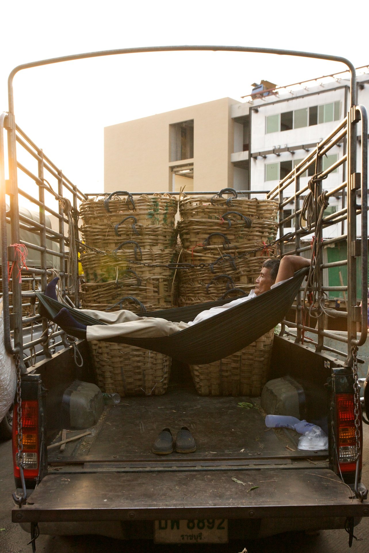 fisherman taking nap, Bangkok, Thailand