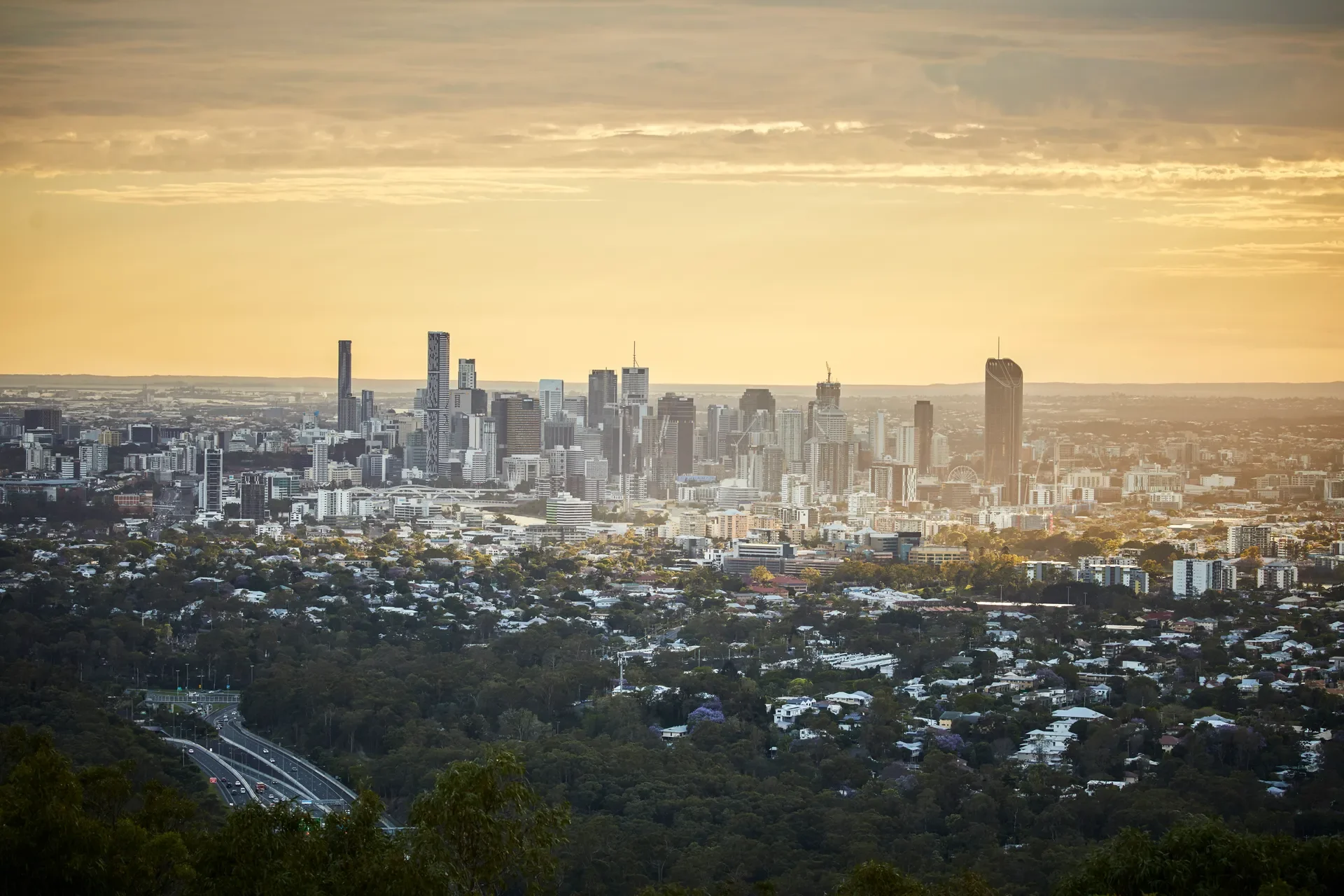 325935-cityscape-of-brisbane-with-the-sun-shedding-golden-light-onto-the-city_mt-coot-tha-web-1920px (1).webp