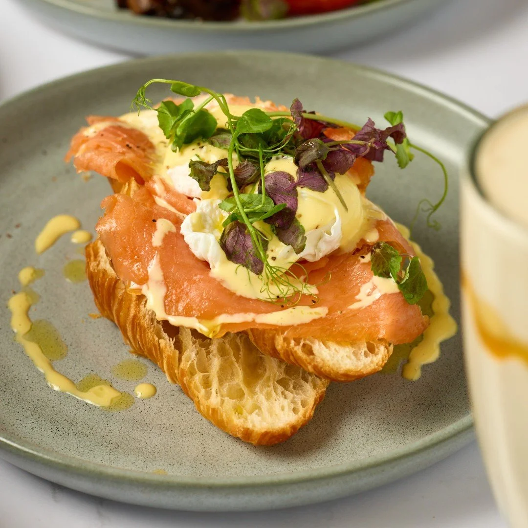 A brunch classic with a Summit flare: Eggs Benedict with hollandaise atop a buttery croissant. Are you choosing the sliced leg ham or smoked salmon version?