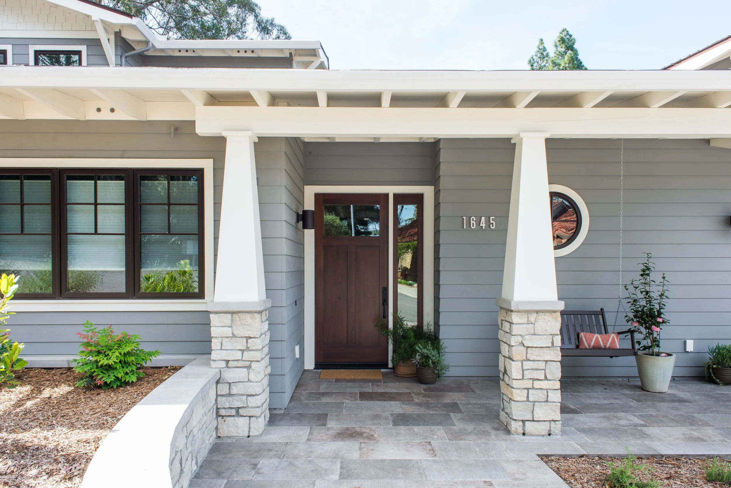 The porch is a hallmark of Craftsman design, and even with a more contemporary approach, preserving this element was essential to both the architects and the clients