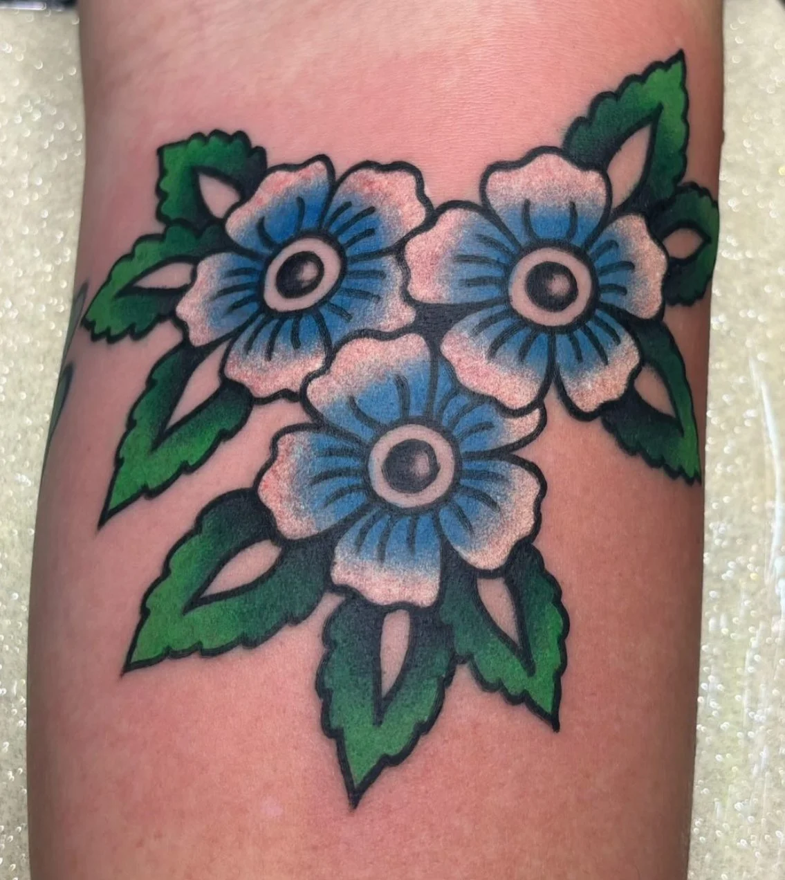 Traditional floral tattoo with bold linework done in San Diego