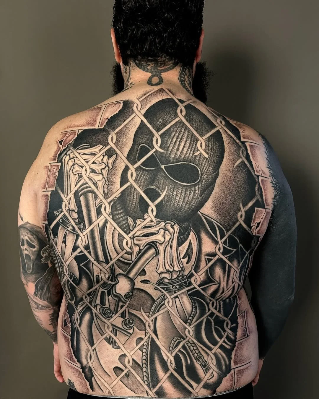 Illustrative back piece tattoo with linework done in San Diego