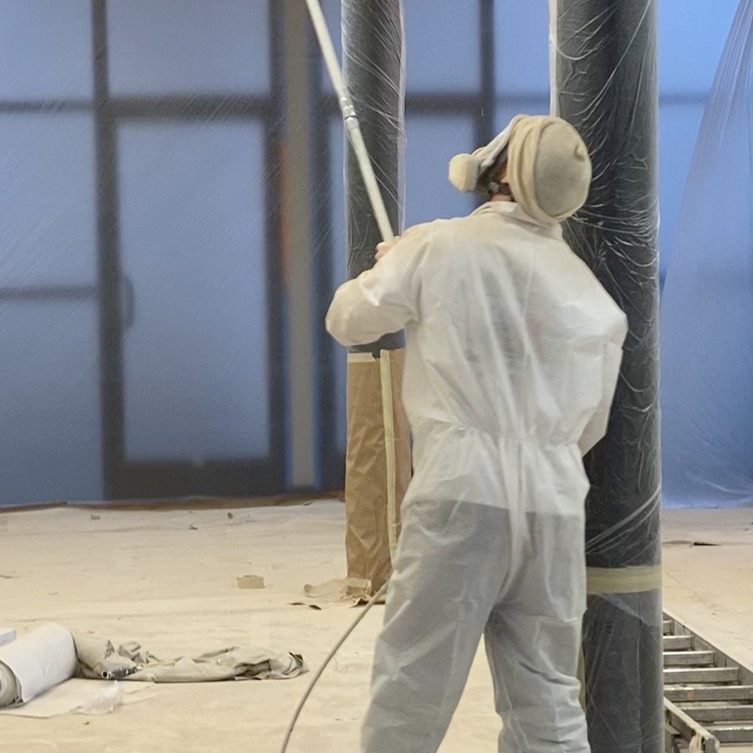 Spraying some tall ceilings in a large office space I painted with Brandon Clemmens in SW Portland. Swipe to see the final product!