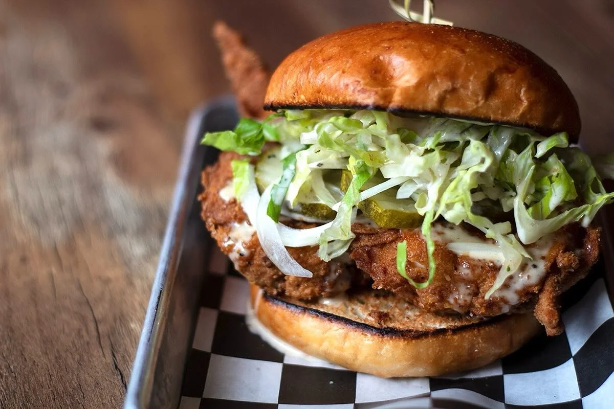 The new White Fang is here 🐺🍗
 Fried chicken thigh, house wing dust, creamy Alabama white, shredded lettuce, spicy dill pickles, and raw onion bite. Cool, tangy, crunchy, and just a little savage.

✨ Limited time only. Come sink your teeth in.

#Fr