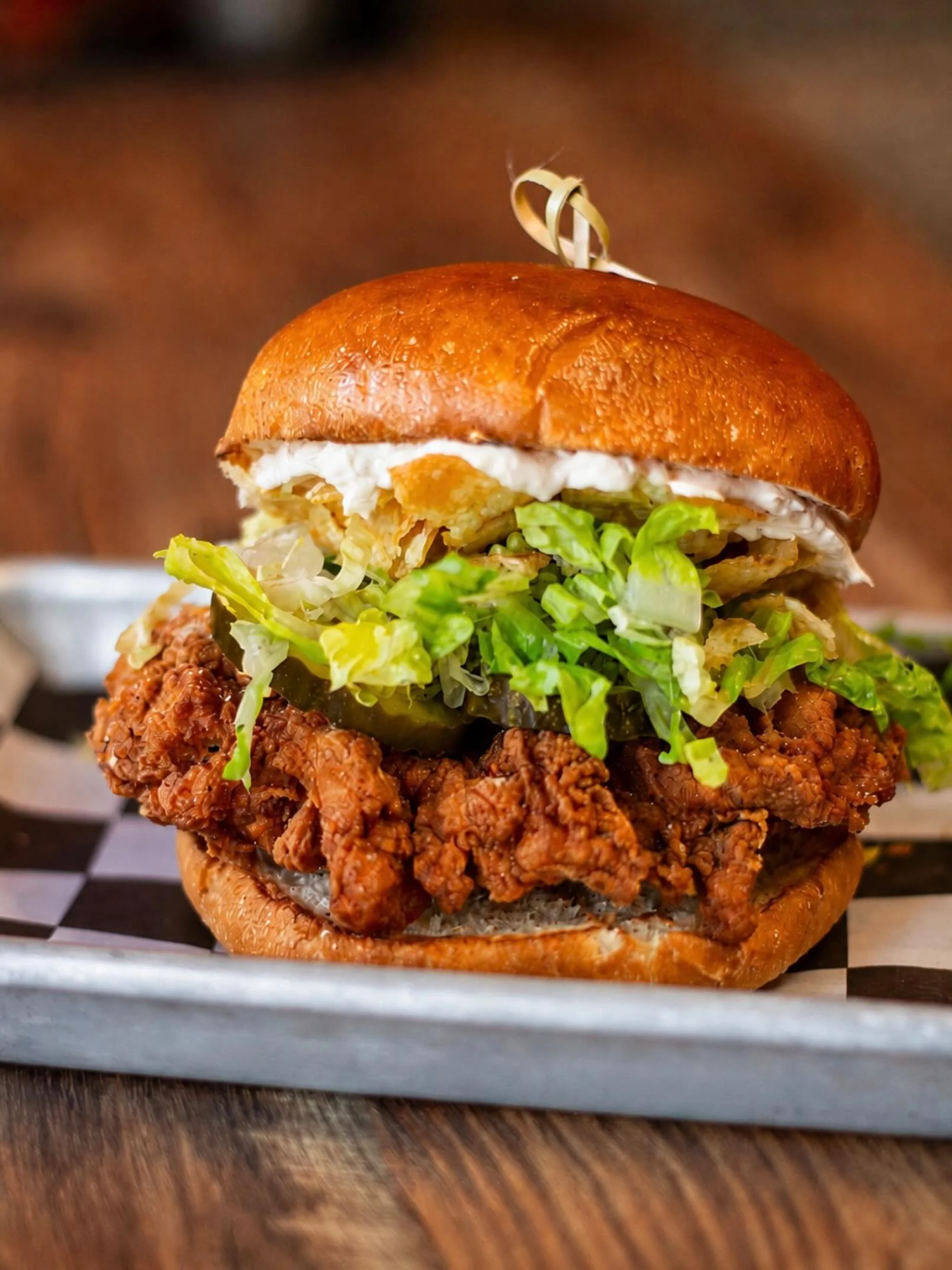 NEW LTO: THE SOUR CREAM &amp; ONION SUPREME 🥔🧅

Fried chicken dusted in sour cream &amp; onion seasoning.
Caramelized onion cream cheese.
Sliced dill pickles.
Black pepper kettle chips.
Shredded lettuce.
Toasted bun.

Somewhere, a gas station snack