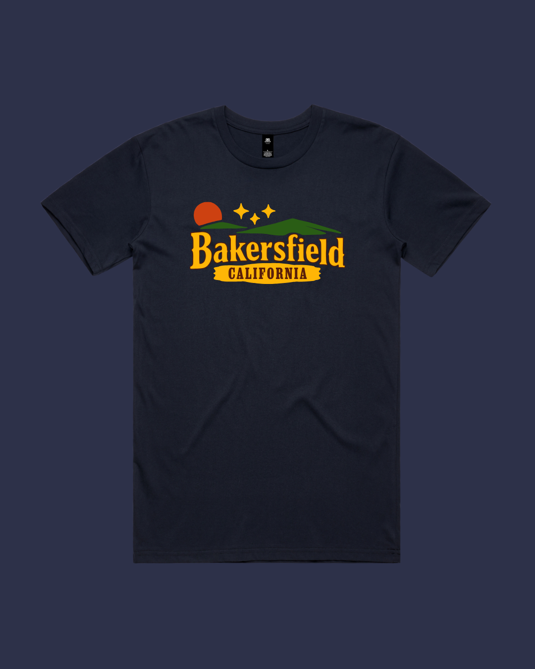 A black T-shirt with a propaganda-style graphic featuring a sunset, mountains, and three stars above the text 'Bakersfield California' in bold orange and yellow letters.