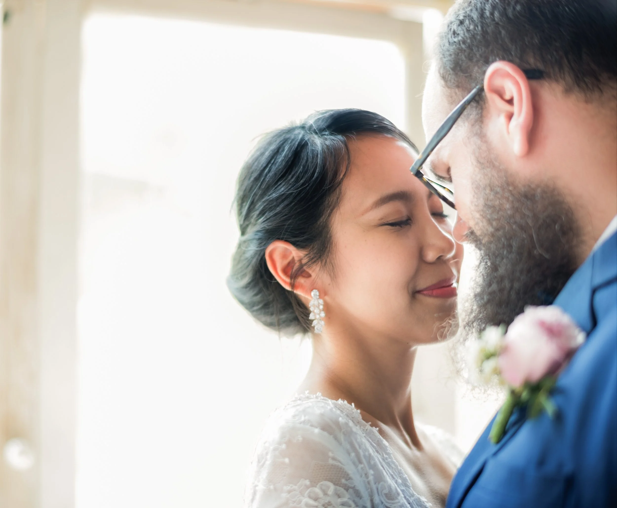 Bride and groom sharing a close portrait at San Francisco City Hall