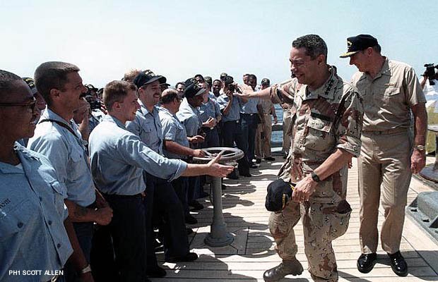 General Colin Powell greeting crew members along side Vice Adm. Henry H. Mauz Jr. (photo from the National Archives)