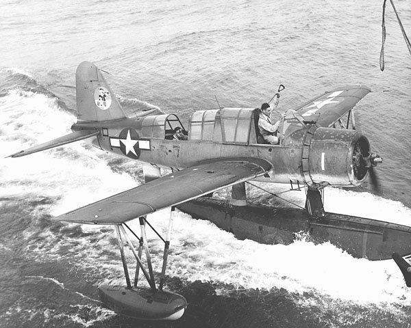 Kingfisher pilot George E. Travis rescues pilot LTJG R. L. Meltebeke, on June 8th, 1945