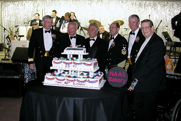 Cake cutters Rear Adm. Turcotte, Mayor Fraim, C. Capestrain, J. Paulk, Capt. Blesch and D. Smith