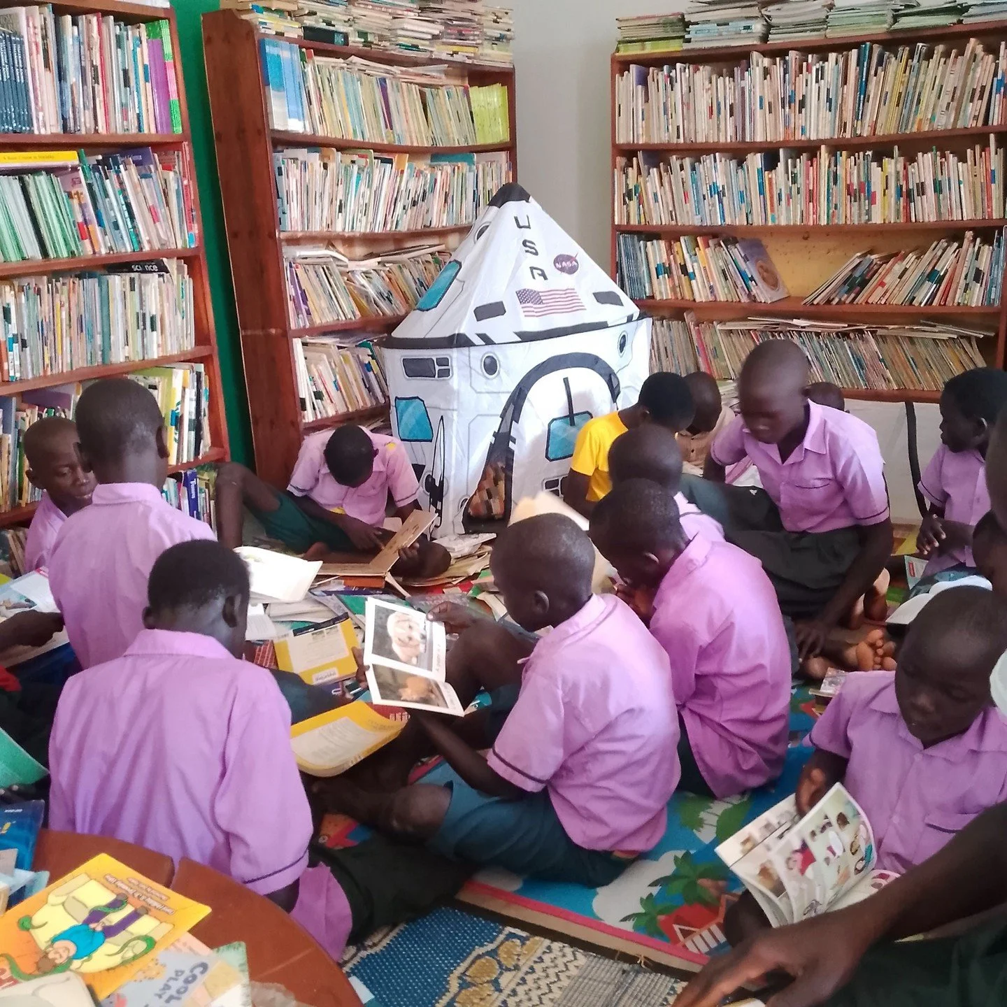 Our reading space at Imvepi Refugee Settlement is pure joy! ✨

Children sprawl across colourful mats, noses buried in picture books, eyes wide as they point at animals marching across the page or giggle at a funny monkey. Some trace the illustrations