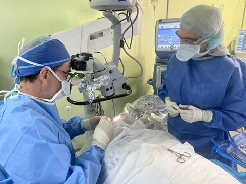 Surgeons performing surgery in an operating room