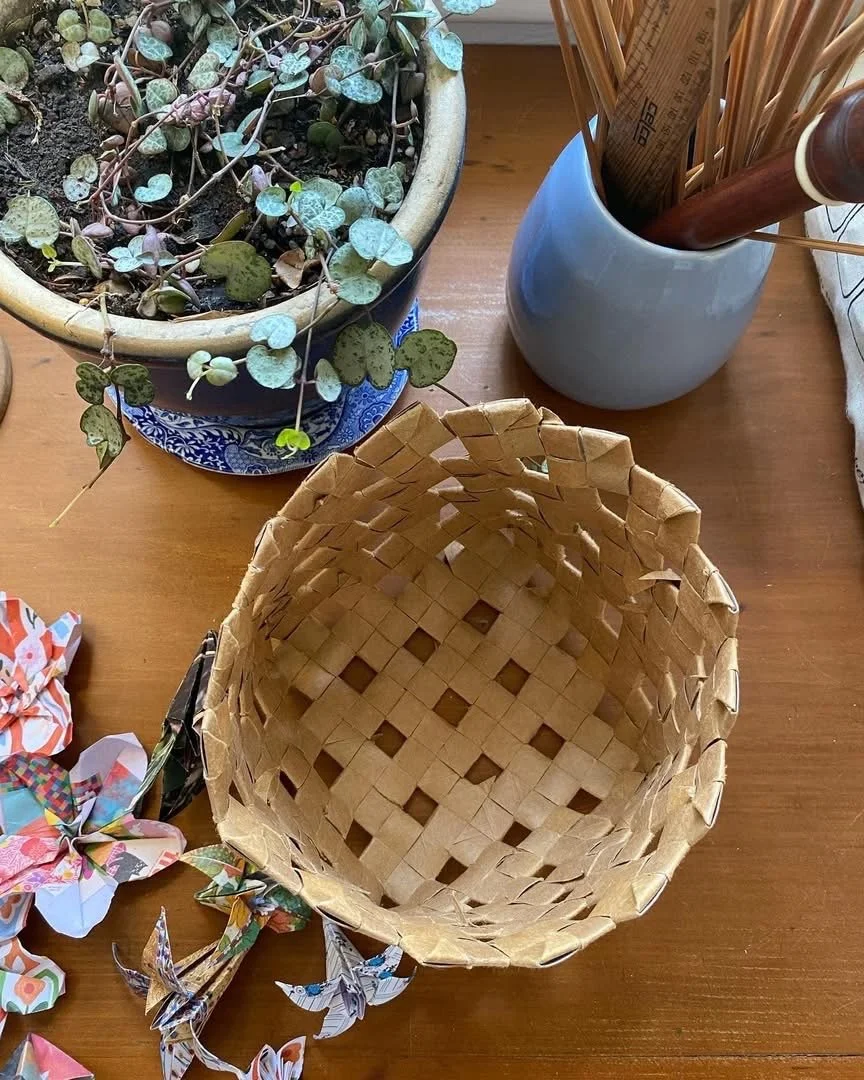 Braided basket made from cardboard toilet rolls and origami flowers made from Frankie magazine pages